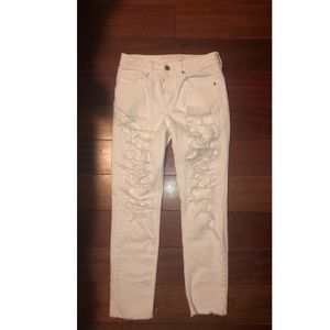 Distressed white denim